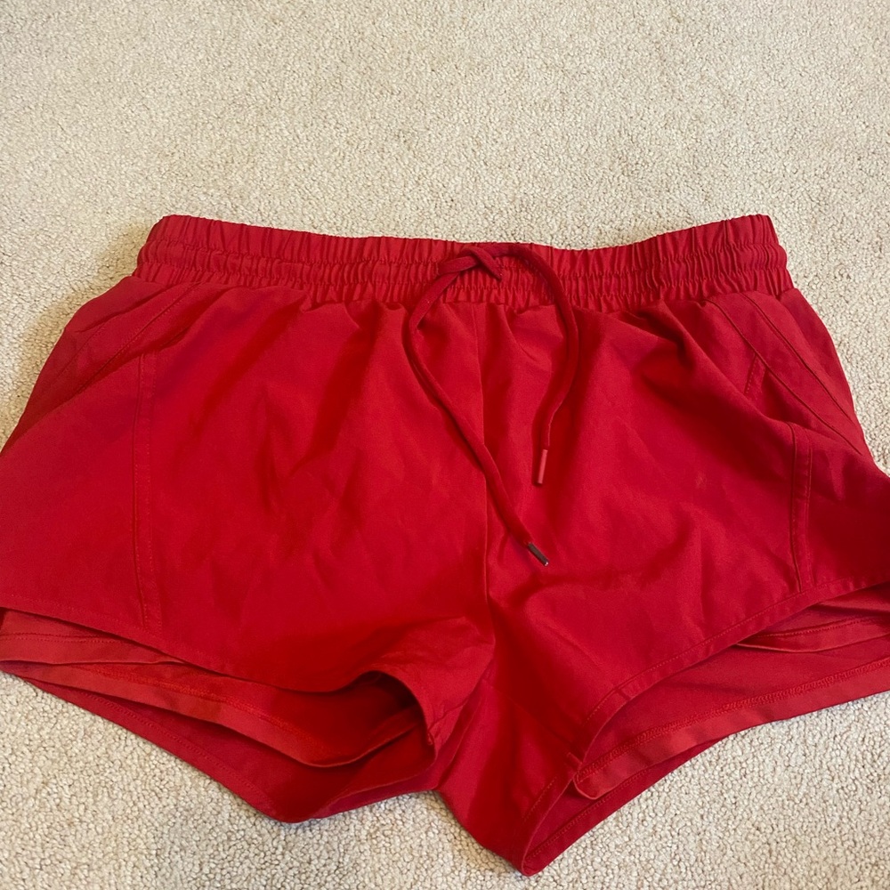 zyia red activewear shorts with shorts underneath